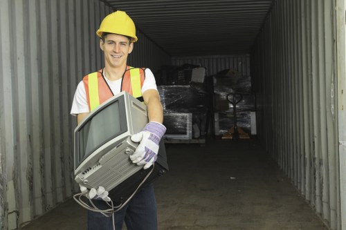 Sorting station at a local transfer facility with labelled recycling streams